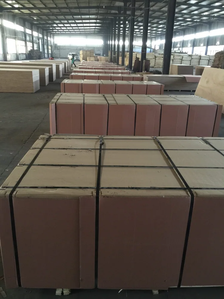 Plywood packs protected and strapped inside our warehouse